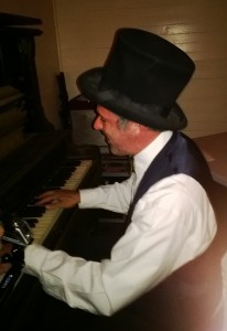 It wouldn't be a saloon without a piano player.